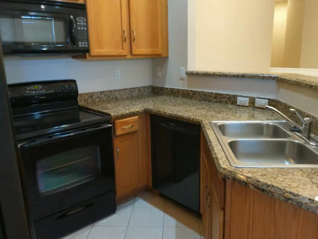3026 Laurel Ridge Circle Riviera Beach, FL 33404 - Photo 3 of 14 kitchen 2