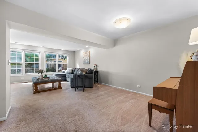 a bed room with furniture and a large window