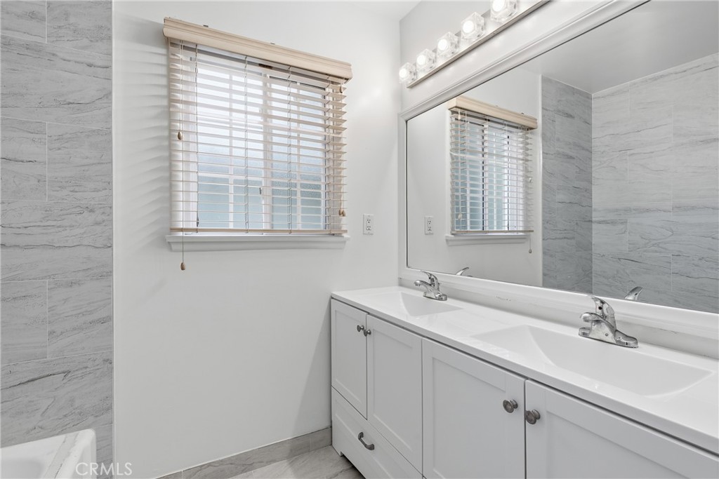 16753 Magnolia Boulevard Encino, CA 91436 - Photo 11 of 30 a bathroom with a sink and a window