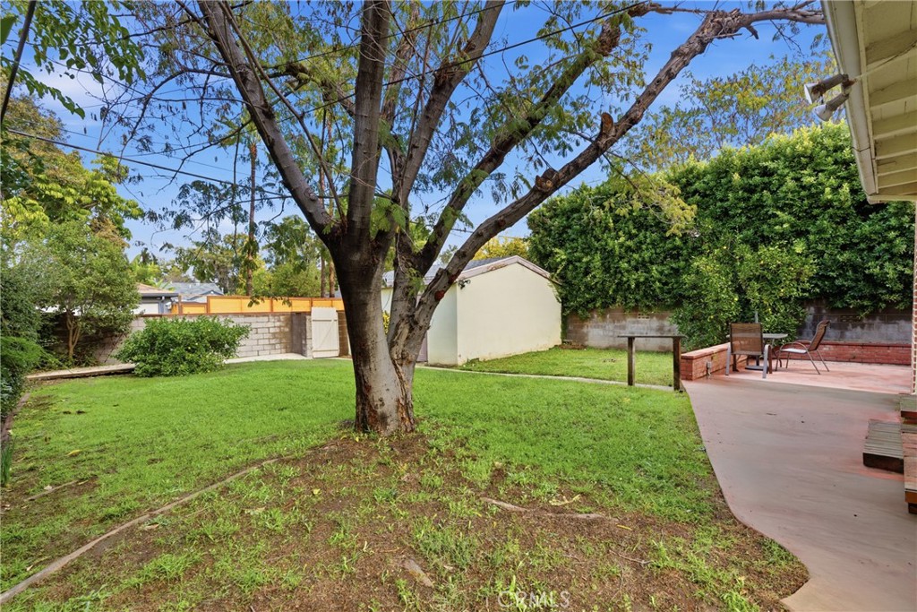 16753 Magnolia Boulevard Encino, CA 91436 - Photo 20 of 30 a view of a backyard with large trees