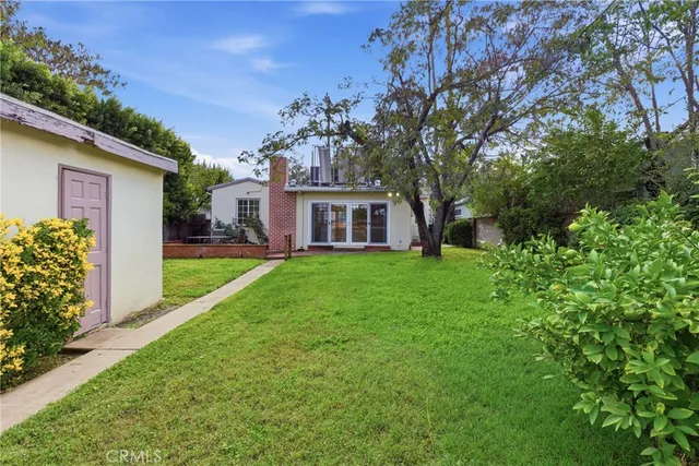 a house view with a garden space