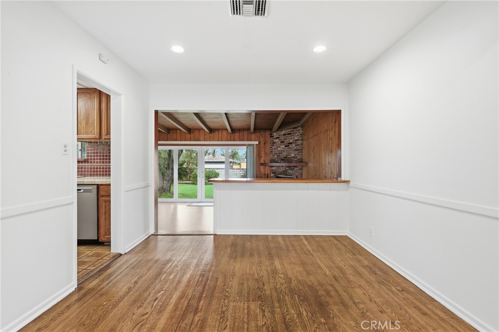 16753 Magnolia Boulevard Encino, CA 91436 - Photo 3 of 30 wooden floor in an empty room with a window
