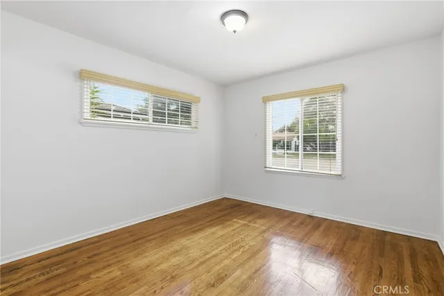an empty room with wooden floor