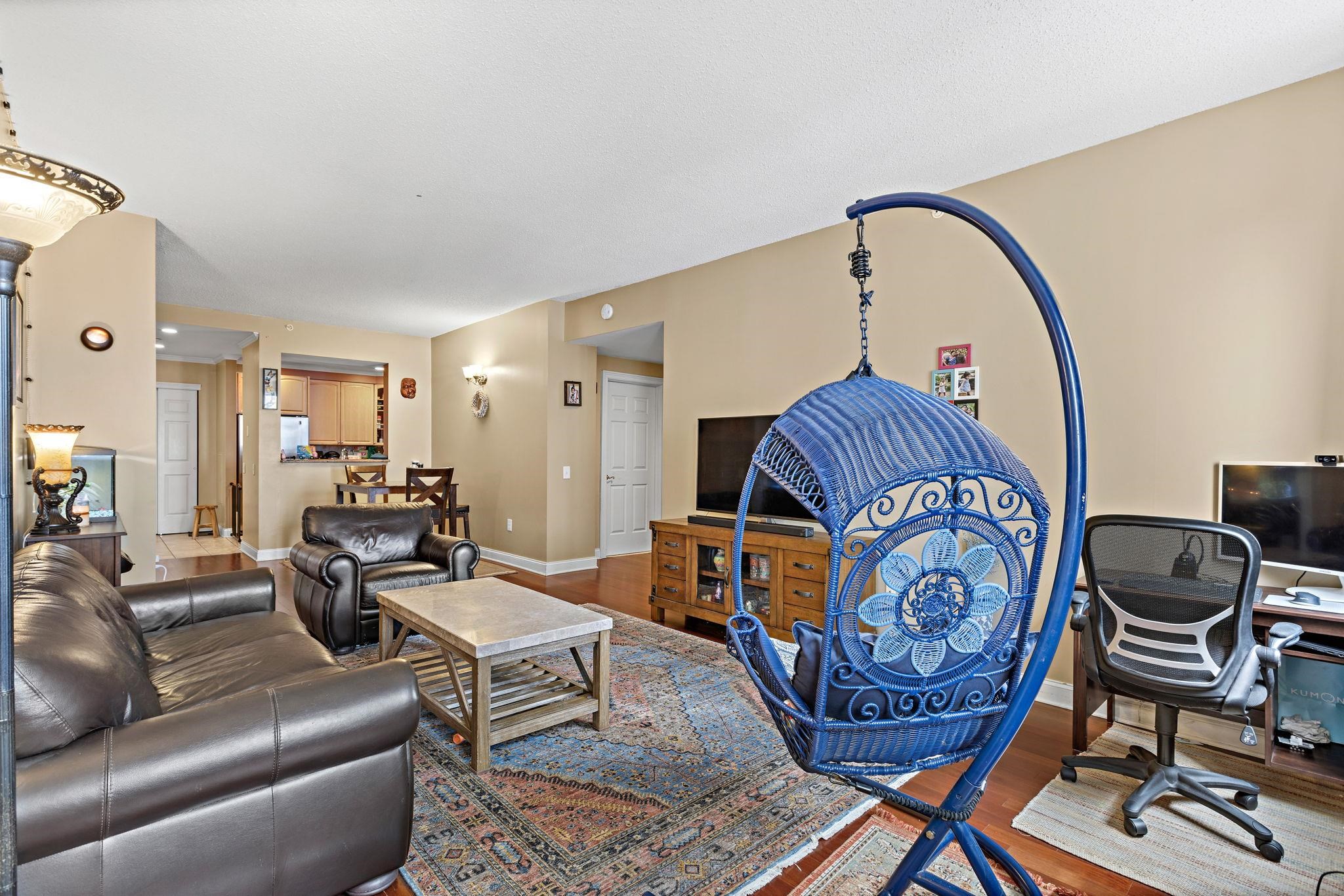 311 Washington Street, Unit 9C Jersey City, NJ 07302 - Photo 8 of 17 a living room with furniture and a mirror