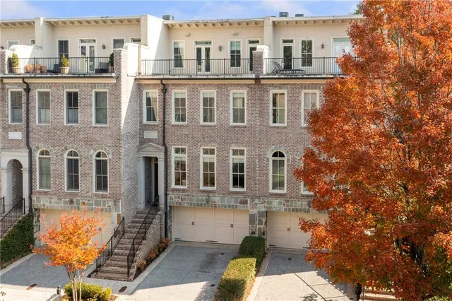 a view of a brick building next to a yard