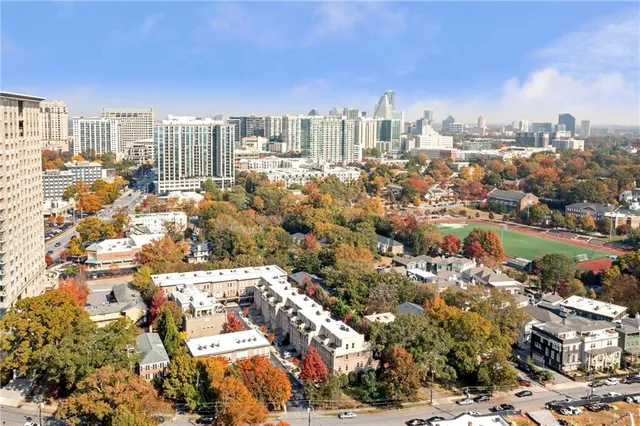 an aerial view of a house with yard