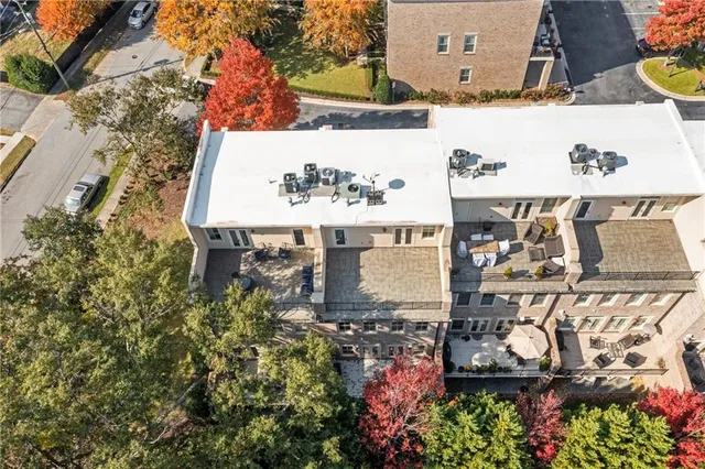 aerial view of a house with a yard