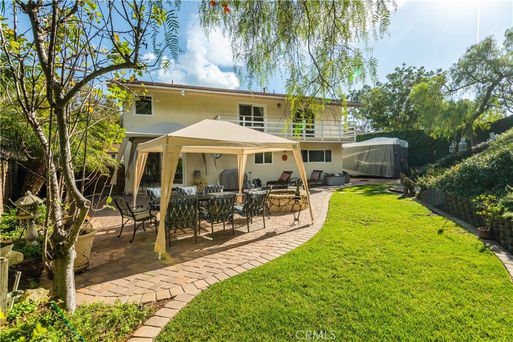 an outdoor space with swimming pool and furniture