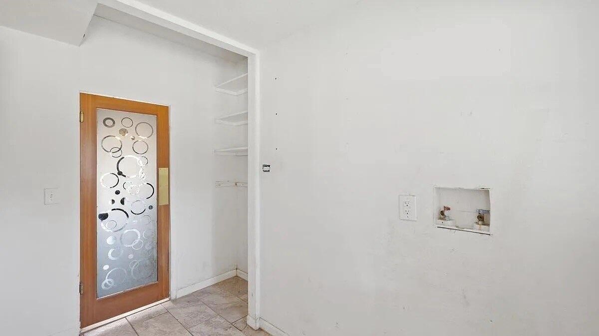 368 Riddle Road Cedar Creek, TX 78612 - Photo 11 of 30 a room with a door