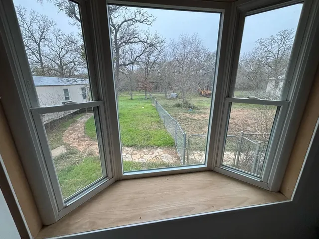 a view of a black door and chair