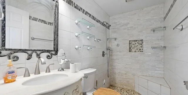 a kitchen with a stove a sink and a microwave