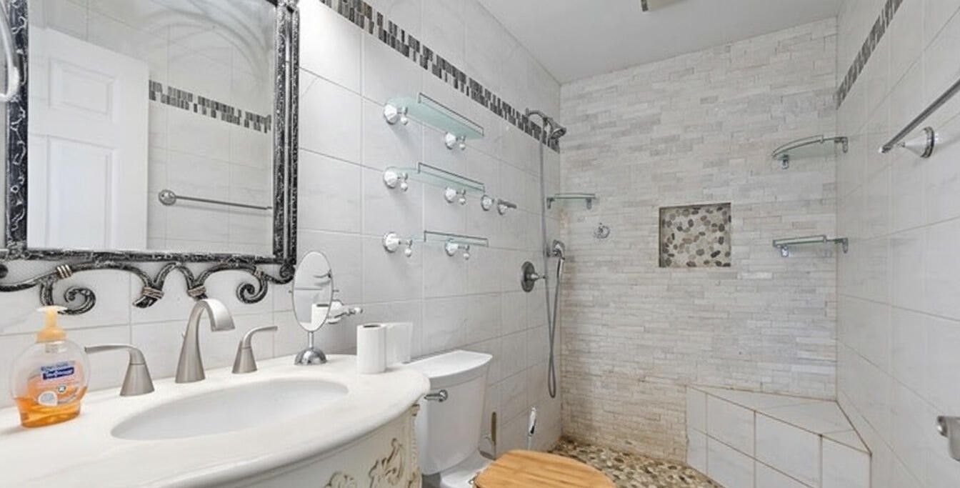 368 Riddle Road Cedar Creek, TX 78612 - Photo 18 of 30 a bathroom with a sink toilet and shower