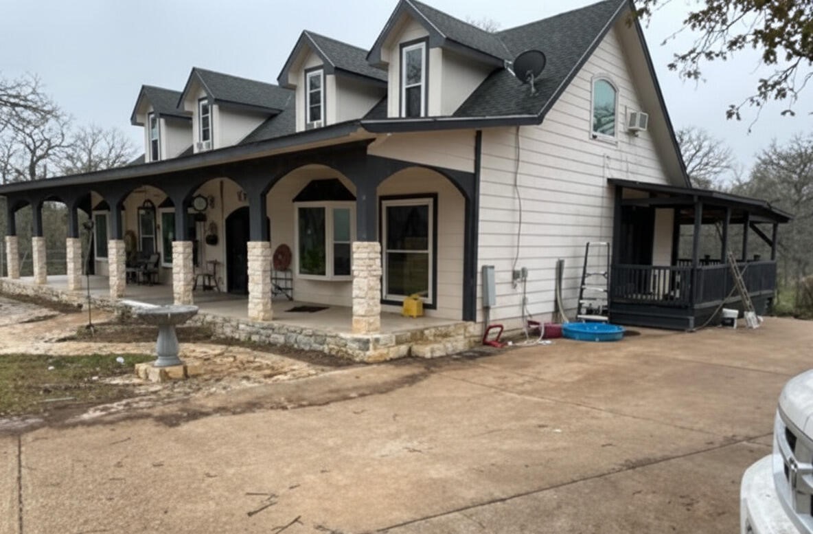 368 Riddle Road Cedar Creek, TX 78612 - Photo 2 of 30 a front view of a house with garden