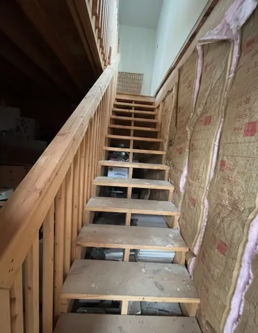 a room with furniture and wooden floor