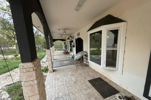 a view of a car park in front of house