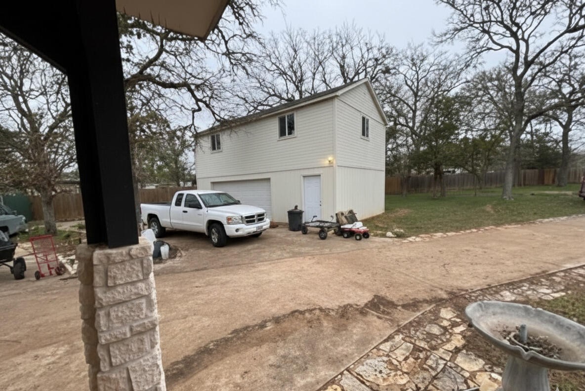 368 Riddle Road Cedar Creek, TX 78612 - Photo 5 of 30 a view of a car park in front of house