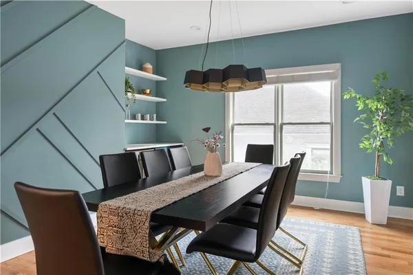 a view of a dining room with furniture and a window