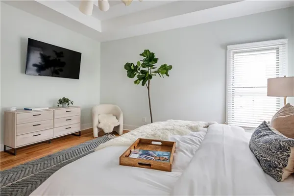 a bedroom with a bed and a window