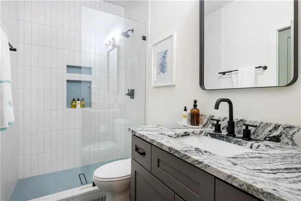 a bathroom with a sink and mirror