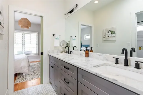 a bathroom with a sink and a mirror