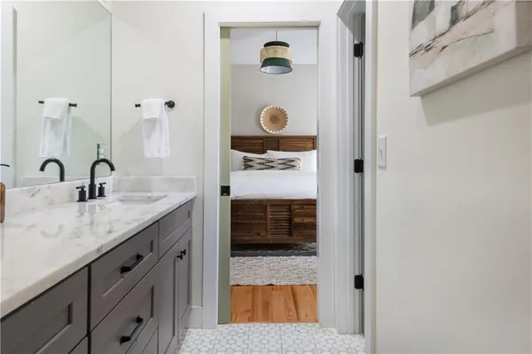 a living room with furniture a rug and a window