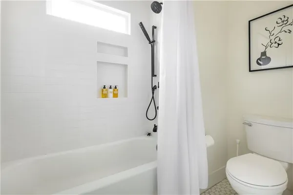 a view of house with deck and outdoor seating