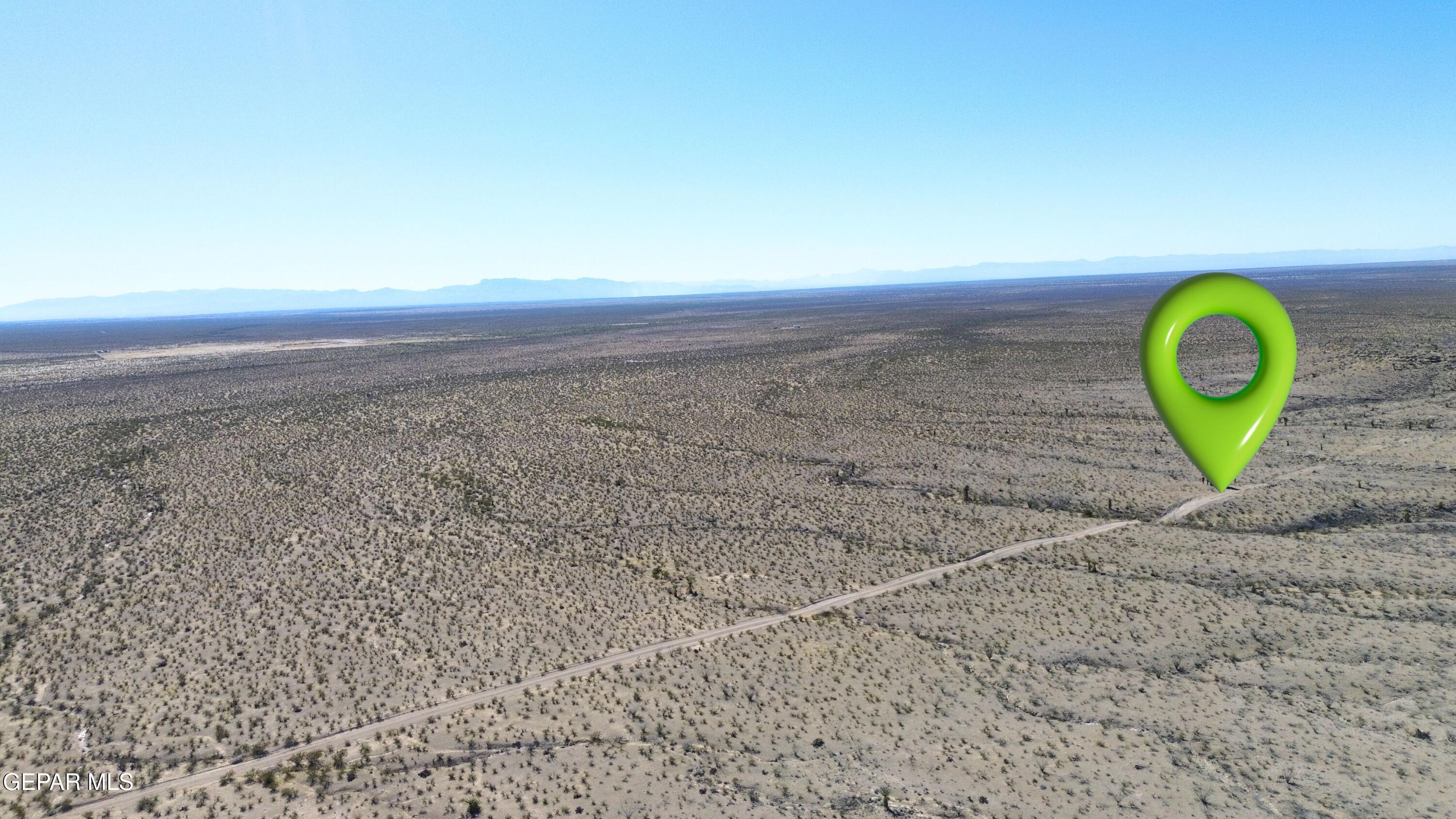 24 Longhorn Ranchettes Ridge Fort Hancock, TX 79839 - Photo 6 of 31 view of a dry yard with wooden fence