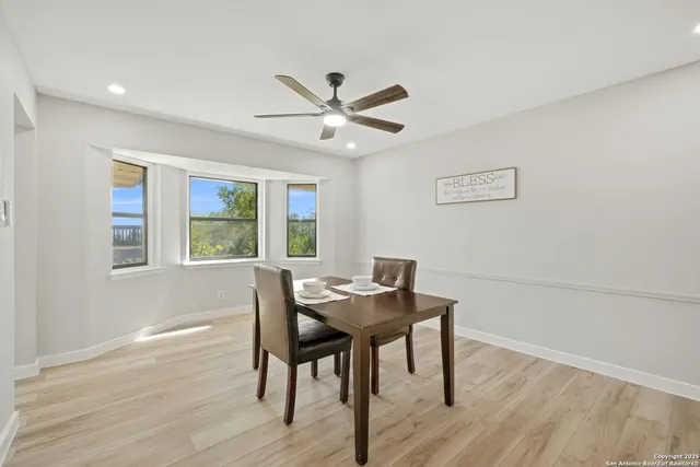 a dining room with furniture and window