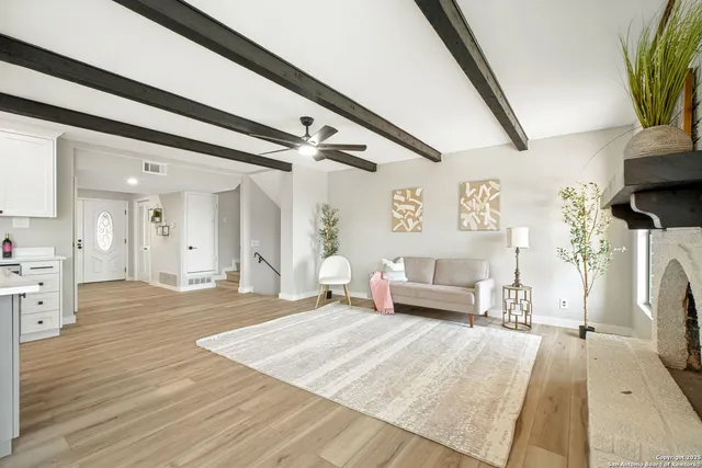 a bedroom with furniture and a fireplace