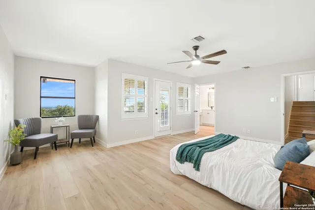 a bedroom with a bed and furniture