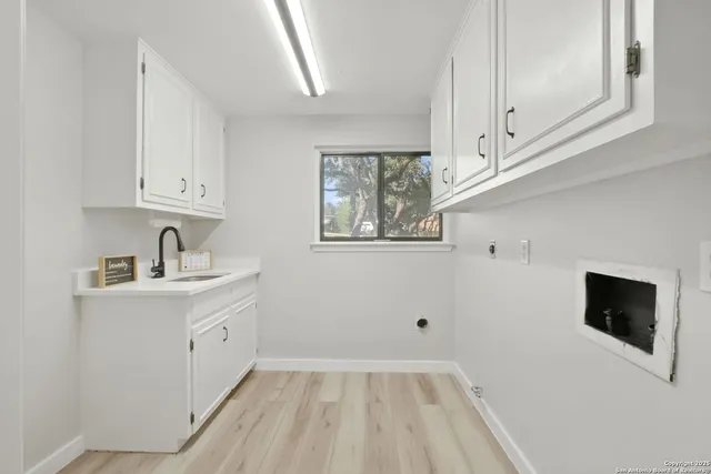 a view of hallway with washer and dryer