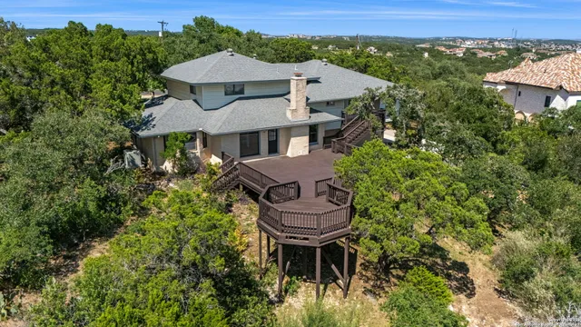 an aerial view of a house with a yard