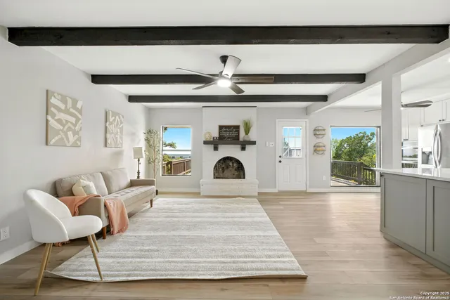 a living room with furniture and a fireplace