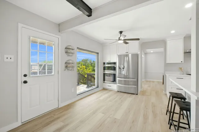 a view of kitchen with stainless steel appliances refrigerator oven and stove