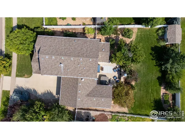 a swimming pool with outdoor seating and yard