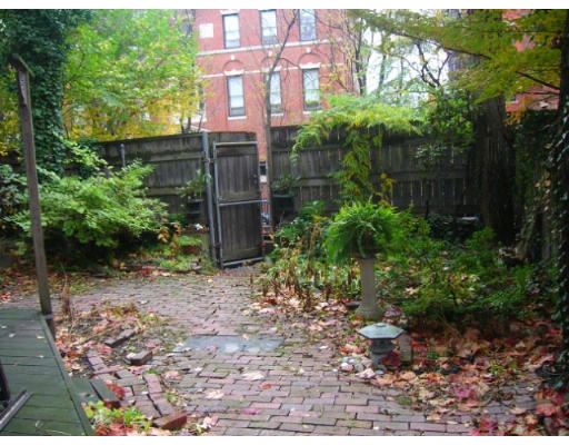 23 Pinckney Street, Unit 1 Boston, MA 02114 - Photo 1 of 1 a backyard of a house with lots of green space
