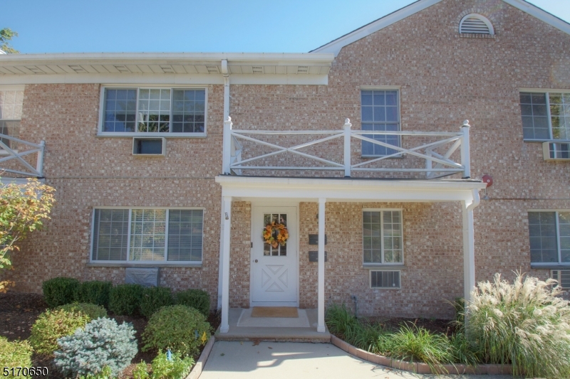27 Corsa Terrace Ridgewood, NJ 07450 - Photo 1 of 10 a front view of a house with a yard