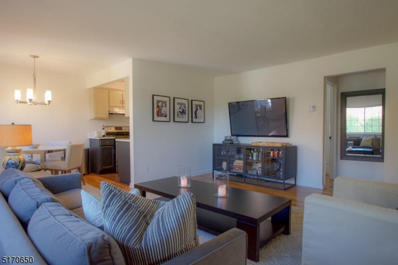 27 Corsa Terrace Ridgewood, NJ 07450 - Photo 4 of 10 a living room with furniture and a flat screen tv