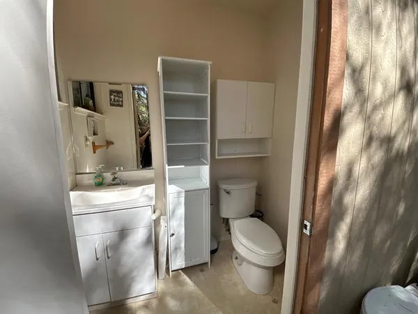 a bathroom with a sink and toilet