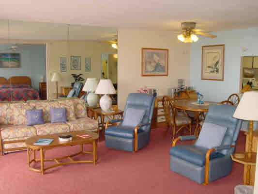 1763 Pe'e Road, Unit 304 Koloa, HI 96756 - Photo 4 of 14 a living room with furniture and a dining table