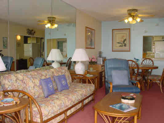 1763 Pe'e Road, Unit 304 Koloa, HI 96756 - Photo 5 of 14 a living room with furniture chandelier and a table