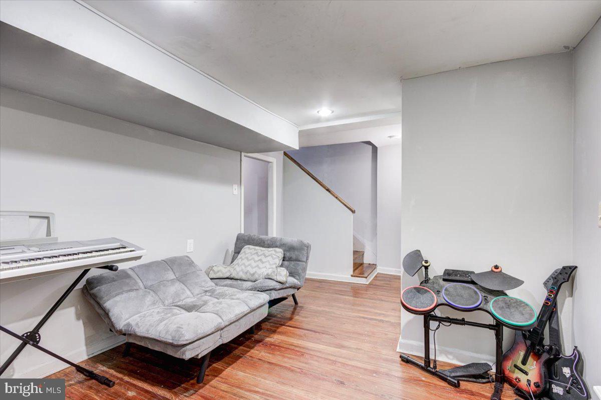 3605 Kimble Road Baltimore, MD 21218 - Photo 23 of 30 a living room with furniture and wooden floor