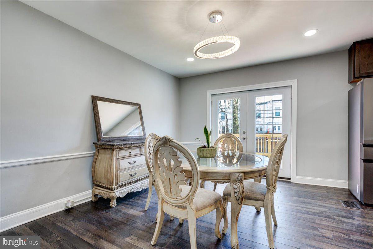3605 Kimble Road Baltimore, MD 21218 - Photo 9 of 30 a dining room with furniture window and wooden floor