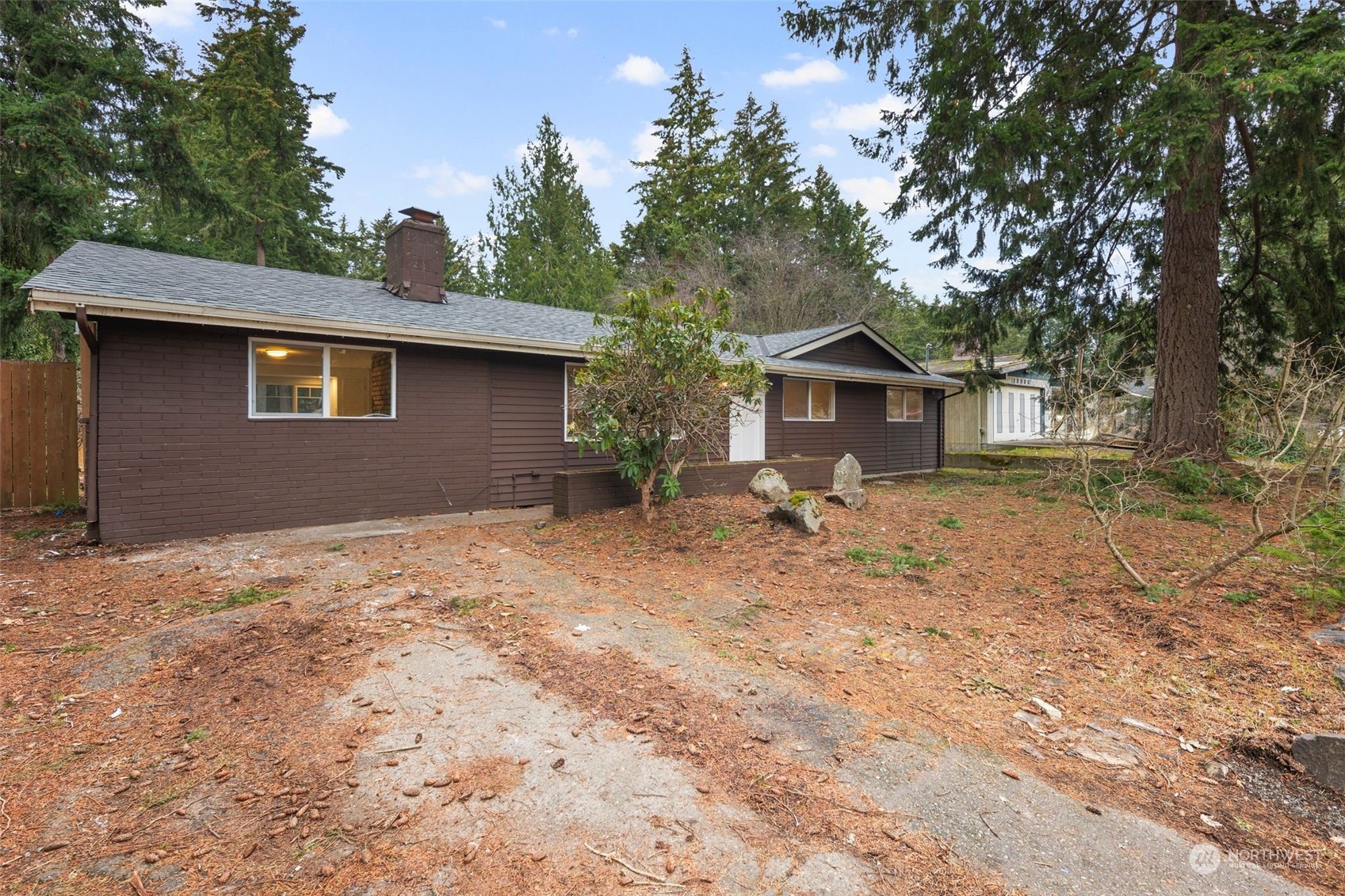 15832 Southeast 144th Street Renton, WA 98059 - Photo 11 of 40 a backyard of a house with table and chairs