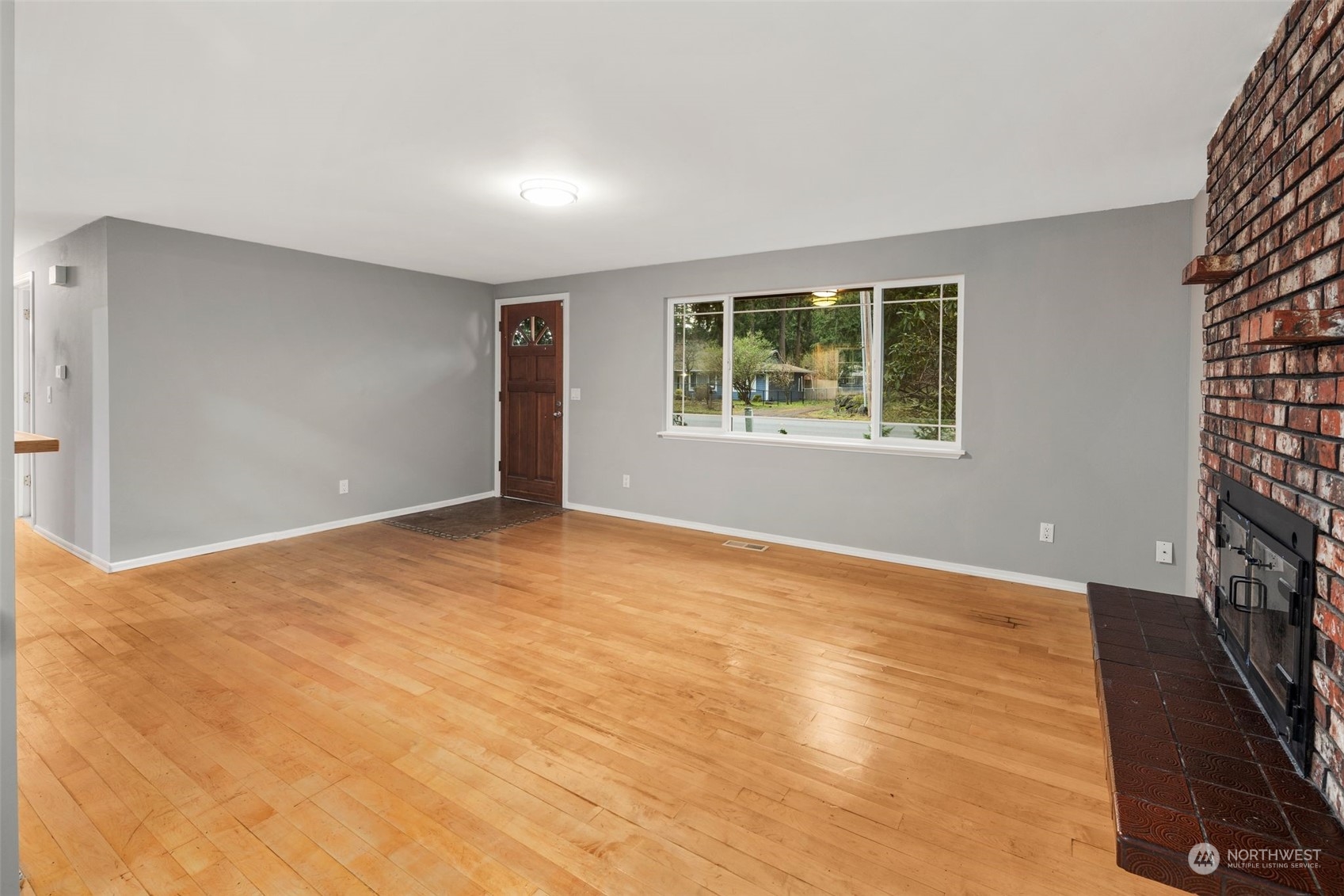 15832 Southeast 144th Street Renton, WA 98059 - Photo 13 of 40 a view of an empty room with a window and closet area