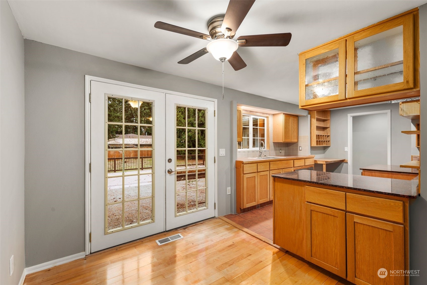 15832 Southeast 144th Street Renton, WA 98059 - Photo 14 of 40 a kitchen with granite countertop cabinets and window