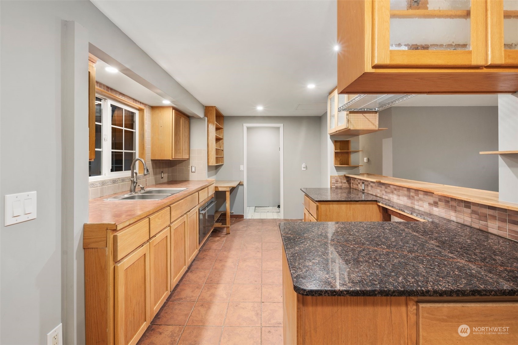 15832 Southeast 144th Street Renton, WA 98059 - Photo 15 of 40 a kitchen with stainless steel appliances granite countertop wooden cabinets a sink and a granite counter tops