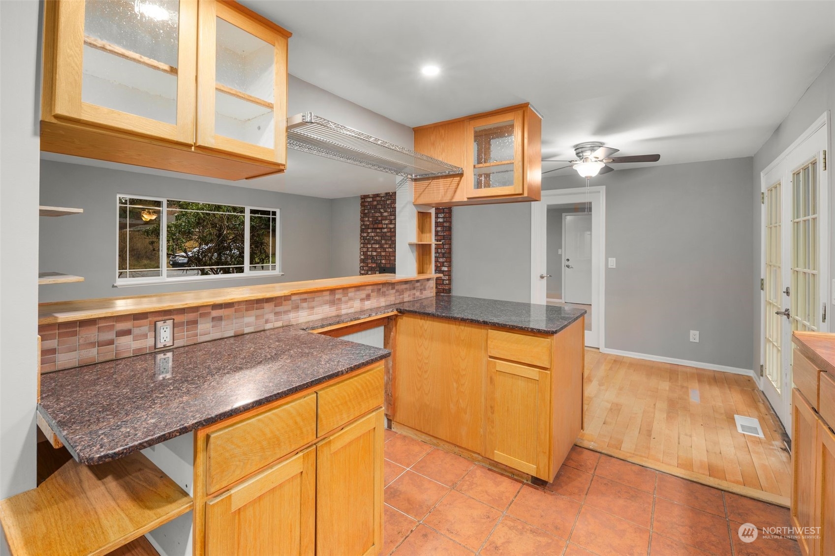 15832 Southeast 144th Street Renton, WA 98059 - Photo 19 of 40 a kitchen with stainless steel appliances granite countertop a sink and a refrigerator