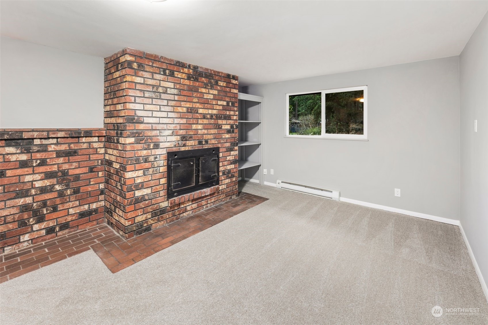 15832 Southeast 144th Street Renton, WA 98059 - Photo 20 of 40 a view of an empty room with a fireplace