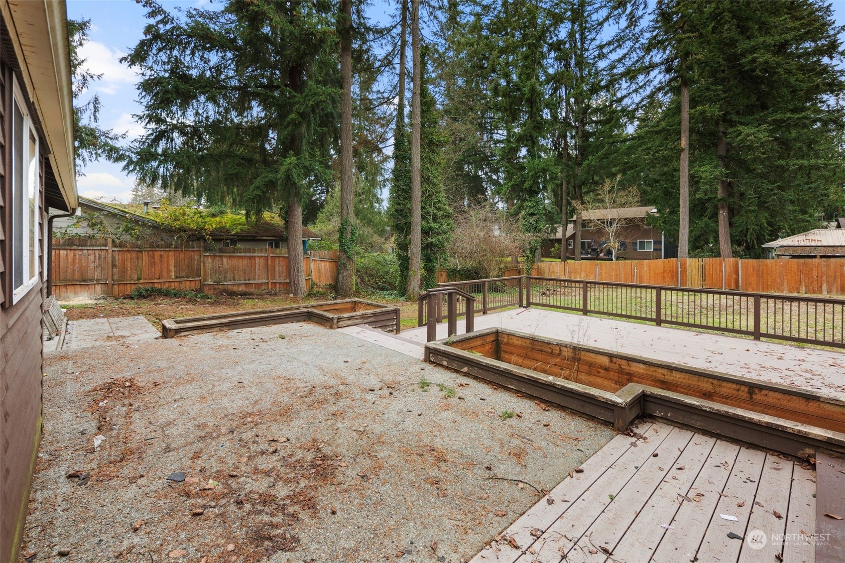 15832 Southeast 144th Street Renton, WA 98059 - Photo 2 of 40 a view of a roof deck with wooden fence and a bench